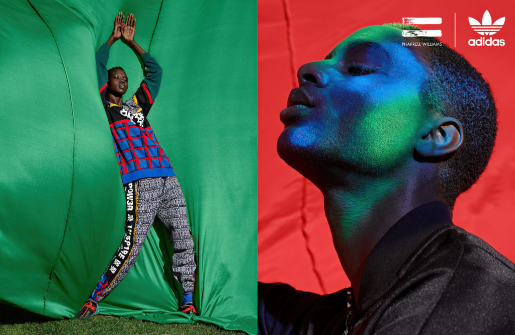 Người mẫu nam tạo dáng trước nền xanh và đỏ trong trang phục thể thao Adidas