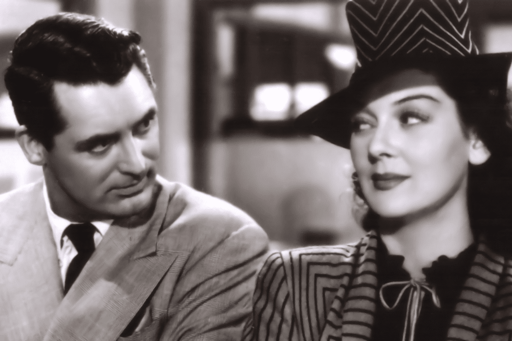 Cặp đôi diễn viên nhìn nhau trong một bộ phim đen trắng cổ điển