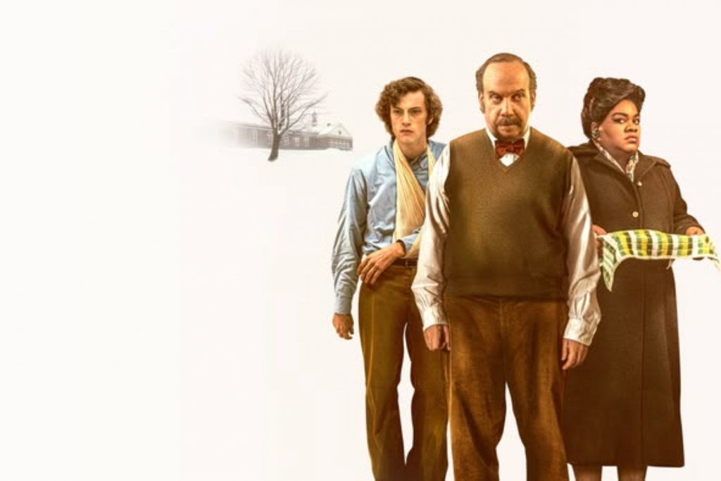 Ba người đứng cạnh nhau trước một tòa nhà và một cây trơ trụi lá vào mùa đông