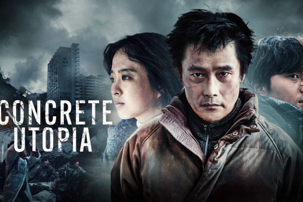 Ba nhân vật chính của phim Concrete Utopia đứng trước phông nền đổ nát